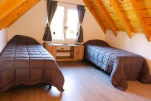 Voodi või voodid majutusasutuse Cabaña en Bariloche para 4 pax toas