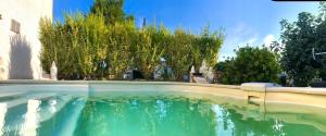 a pool of water in front of a building at Villa Maolo 2 in Roquebrune-sur-Argens