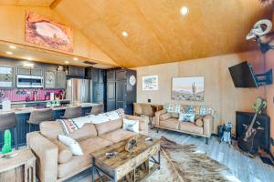 a living room with a couch and a table at Colorado River Getaway in Parachute Dogs Welcome! in Parachute
