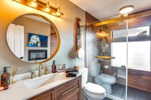 a bathroom with a sink and a toilet and a mirror at Colorado River Getaway in Parachute Dogs Welcome! in Parachute +23 photos