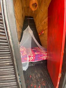 Letto o letti in una camera di Tipiland baru la casa del mono