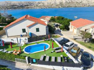 an aerial view of a house with a swimming pool at Villa Marin in Pag