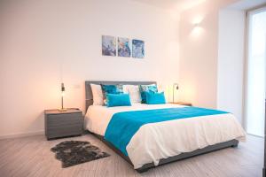 Postel nebo postele na pokoji v ubytování Gavirate Lake apartment