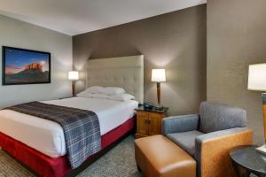 A bed or beds in a room at Drury Inn & Suites Phoenix Happy Valley