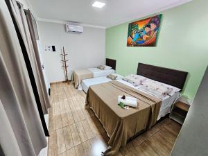 Meu Xodó Pousada客房内的一张或多张床位