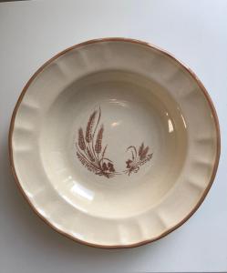 a white plate with a bird design on it at Baker's house in Clermont-Ferrand +16 photos