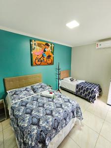 Postel nebo postele na pokoji v ubytování Meu Xodó Pousada + 25 fotografií