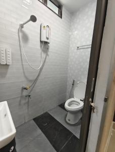 a bathroom with a toilet and a shower at Chani House Hatyai in Hat Yai +24 photos