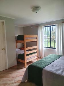 Postel nebo postele na pokoji v ubytování Nido Del Bosque