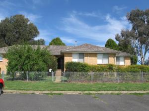 a brick house with a fence in front of it at Hayden House in Delegate