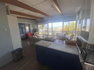 a living room with a view of a living room at Straight to the Point in Pine Point +6 photos