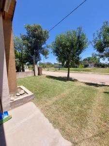 a view of a yard with a tree and a street at Lo de nina in Miramar