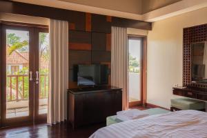 Телевизор и/или развлекательный центр в Bali Stile villa