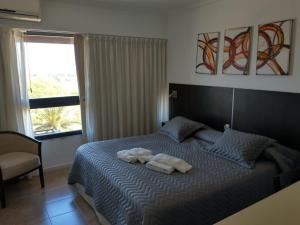 Postel nebo postele na pokoji v ubytování Apart Hotel 22 Rio Manso + 19 fotografií