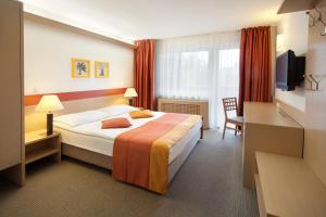 Postel nebo postele na pokoji v ubytování Garni Hotel Savica - Sava Hotels & Resorts