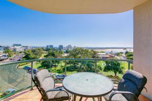 a balcony with a table and chairs and a view of the ocean at Argyle on the Park in Maroochydore