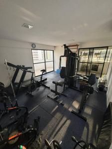 a gym with several tread machines in a room at Flat Rosarinho - Confortável e Super Completo in Recife +27 photos