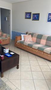 a living room with a couch and a coffee table at Casa do Jardim in Curitiba +28 photos