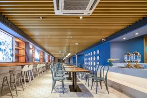 Restavracija oz. druge možnosti za prehrano v nastanitvi 利怡酒店汕头高铁站万象城店