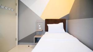 Ένα ή περισσότερα κρεβάτια σε δωμάτιο στο Simple 2BR Connected to Mall at Anderson Supermall Mansion Apartment By Travelio +18 φωτογραφίες
