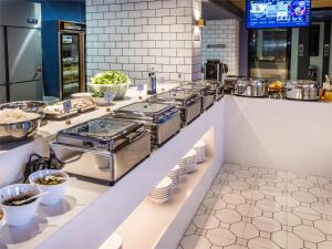 Restavracija oz. druge možnosti za prehrano v nastanitvi 利怡酒店汕头高铁站万象城店