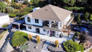 an overhead view of a white house with a roof at Peachland Lake View Spectacular! in Peachland