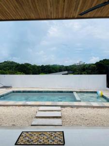 a swimming pool on top of a house at Casa Paloma in Playa Grande