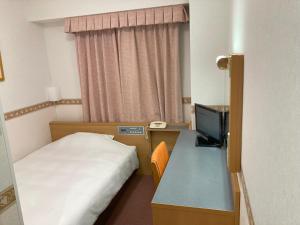 Voodi või voodid majutusasutuse Hotel Alpha-One Miyoshi toas