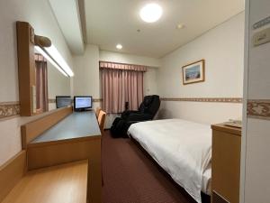 Voodi või voodid majutusasutuse Hotel Alpha-One Miyoshi toas