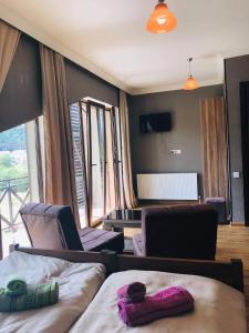 Postel nebo postele na pokoji v ubytování Bakuriani Rooms