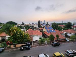 a view of a city with cars parked on a street at Short term Stay in Rehovot Central location near Nes Ziona Rishon Lezion Jerusalem and Tel Aviv in Rechovot