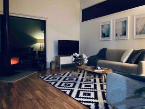 TV o dispositivi per l'intrattenimento presso Architecturally Designed Rural Retreat