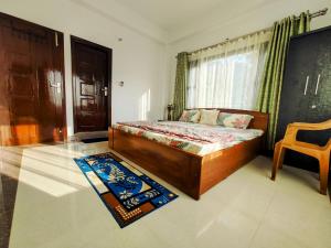 a bedroom with a wooden bed and a window at Whispering Meadows U get entire 3 BHK in Shimla