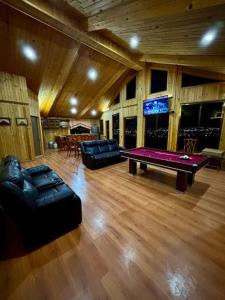 a living room with a ping pong table in it at Casa del árbol in Pachuca de Soto