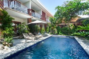 a swimming pool in the backyard of a villa at Anindya Sanur in Sanur