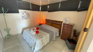 a bedroom with a bed with red roses on it at Luxury Estudio CH&H in Benalmádena +24 photos