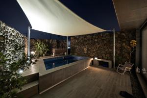 a swimming pool in the middle of a house at 볼다 bolda in Jeju