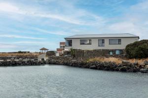 a house on the shore of a body of water at 볼다 bolda in Jeju