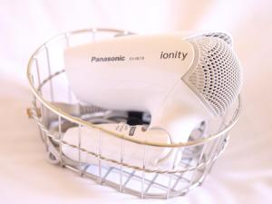 a wire basket with a hair dryer in it at Dormy Inn Express Mikawaanjo in Anjomachi