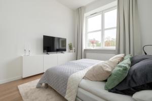 Posteľ alebo postele v izbe v ubytovaní Gagarina Warszawa Przytulne Studio by Noclegi Renters