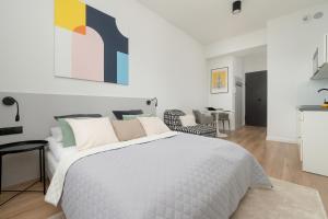 Posteľ alebo postele v izbe v ubytovaní Gagarina Warszawa Przytulne Studio by Noclegi Renters
