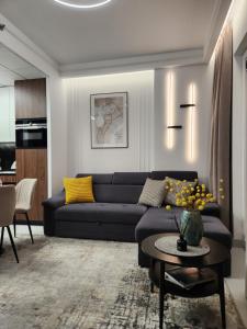 Posedenie v ubytovaní Luksusowy Apartament Bliska Wola SABA
