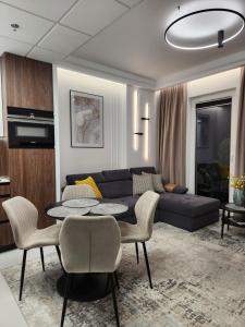 Posedenie v ubytovaní Luksusowy Apartament Bliska Wola SABA