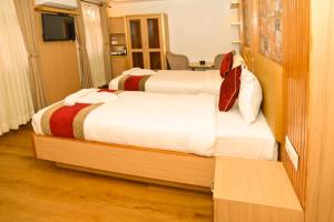 Voodi või voodid majutusasutuse Hotel Elegant Kathmandu Inn toas