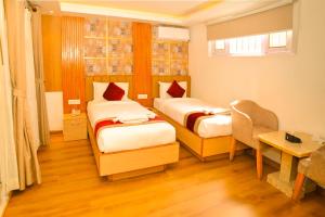Voodi või voodid majutusasutuse Hotel Elegant Kathmandu Inn toas