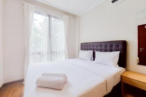 Postel nebo postele na pokoji v ubytování Modern Look 1BR at Asatti Apartment By Travelio + 14 fotografií