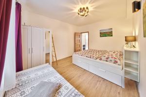 Postel nebo postele na pokoji v ubytování Apartmán - Dovolená Žacléř
