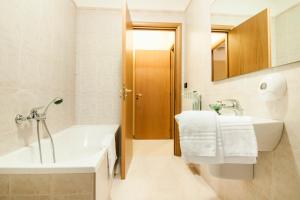 Koupelna v ubytování Ciao Hotel & Residence - Apartments + 37 fotografií
