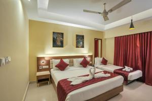 Postel nebo postele na pokoji v ubytování Park Avenue Hotel & Apartments Trichy