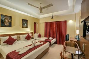 Postel nebo postele na pokoji v ubytování Park Avenue Hotel & Apartments Trichy